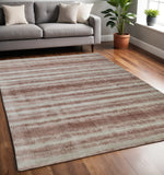 Homeroots 5' X 8' Tan And Ivory Abstract Hand Woven Area Rug Tan,Ivory,Pink Viscose 514422