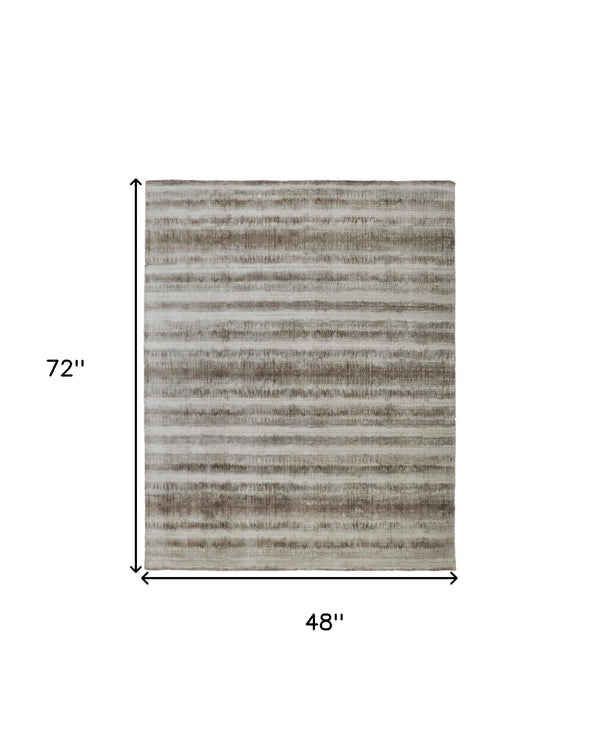 Homeroots 4' X 6' Tan And Ivory Abstract Hand Woven Area Rug Tan,Ivory,Brown Viscose 514435