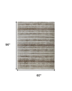 Homeroots 5' X 8' Tan And Ivory Abstract Hand Woven Area Rug Tan,Ivory,Brown Viscose 514436