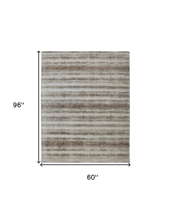 Homeroots 5' X 8' Tan And Ivory Abstract Hand Woven Area Rug Tan,Ivory,Brown Viscose 514436