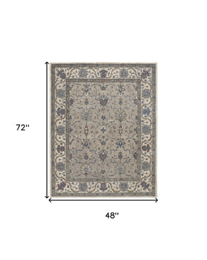 Homeroots 4' X 6' Ivory And Blue Wool Floral Hand Tufted Area Rug  Wool 514810