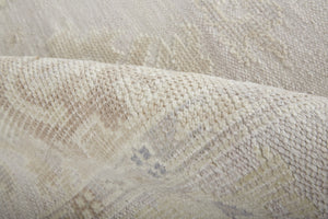 Homeroots 2' X 3' Tan Ivory And Orange Floral Hand Knotted Stain Resistant Area Rug  Other Material 515011