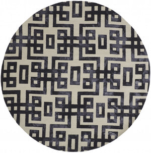 Homeroots 10' Ivory And Black Round Wool Tufted Handmade Stain Resistant Area Rug  Wool 515014
