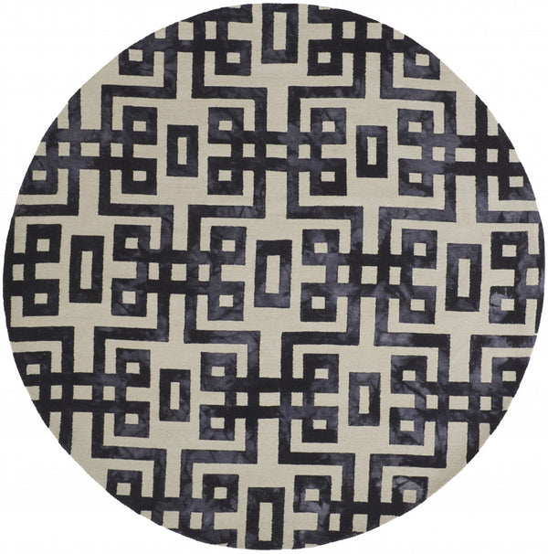 Homeroots 10' Ivory And Black Round Wool Tufted Handmade Stain Resistant Area Rug  Wool 515014