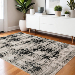 HomeRoots 9' Modern Black Gray and White Abstract Area Rug - Stylish, Durable Design for Any Room Space 4' X 6' 515292