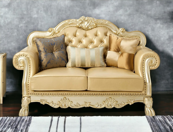 HomeRoots 64" Bone Faux Leather Loveseat with Gold Trim, Toss Pillows & Elegant Button Tufting for Comfort 515706