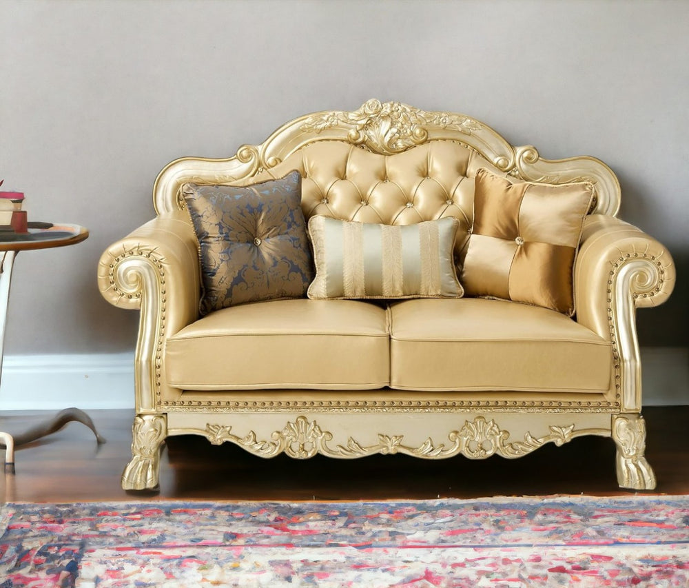 HomeRoots 64" Bone Faux Leather Loveseat with Gold Trim, Toss Pillows & Elegant Button Tufting for Comfort 515706