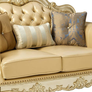 HomeRoots 64" Bone Faux Leather Loveseat with Gold Trim, Toss Pillows & Elegant Button Tufting for Comfort 515706