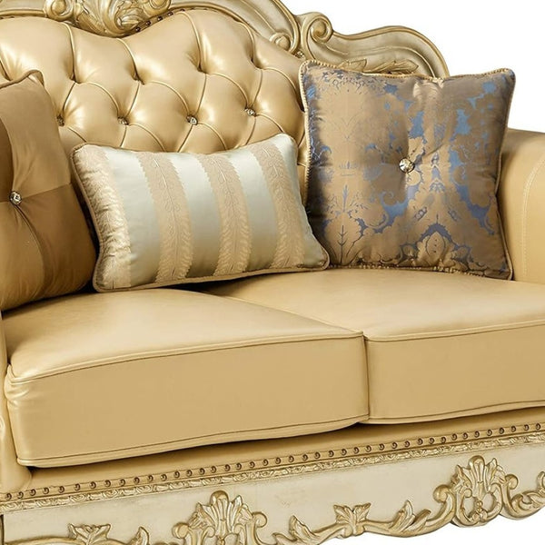 HomeRoots 64" Bone Faux Leather Loveseat with Gold Trim, Toss Pillows & Elegant Button Tufting for Comfort 515706