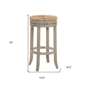 Homeroots 30" Natural And Gray Solid Wood Swivel Backless Bar Height Bar Chair   516136