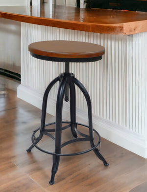 Homeroots 23" Chestnut And Black Steel Swivel Backless Adjustable Height Bar Chair   516177