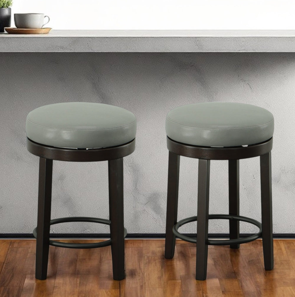 Homeroots Set Of Two 24" Gray And Espresso Faux Leather And Solid Wood Swivel Backless Counter Height Bar Chairs   516204