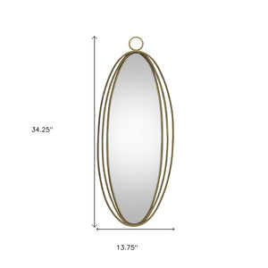 Homeroots 34" Gold Oval Metal Framed Accent Mirror   516379