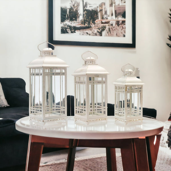 HomeRoots Set of Three Elegant Ivory Metal Mirrored Floor Lantern Candle Holders for Timeless Décor Style 516433