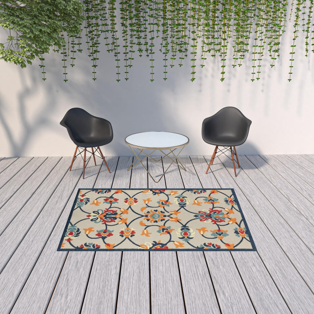Homeroots 5' X 8' Blue And Orange Floral Non Skid Indoor Outdoor Area Rug Navy,Orange,Red,Off,White Polypropylene 517453