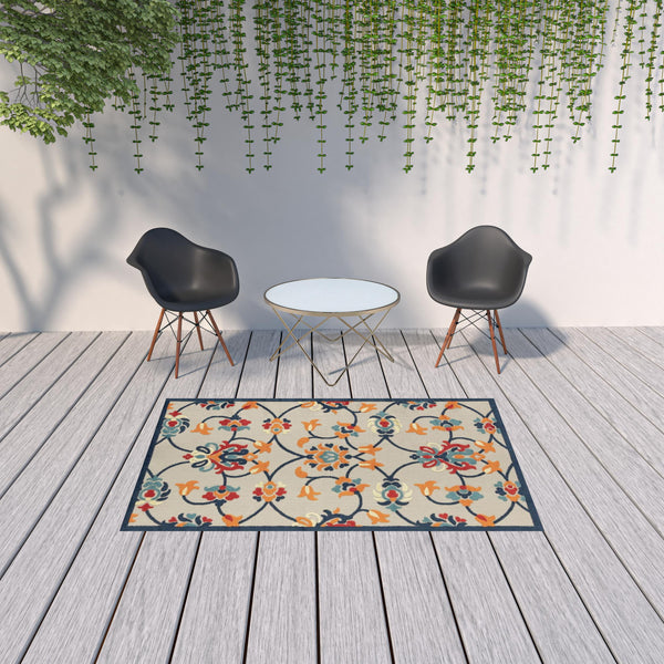 Homeroots 5' X 8' Blue And Orange Floral Non Skid Indoor Outdoor Area Rug Navy,Orange,Red,Off,White Polypropylene 517453