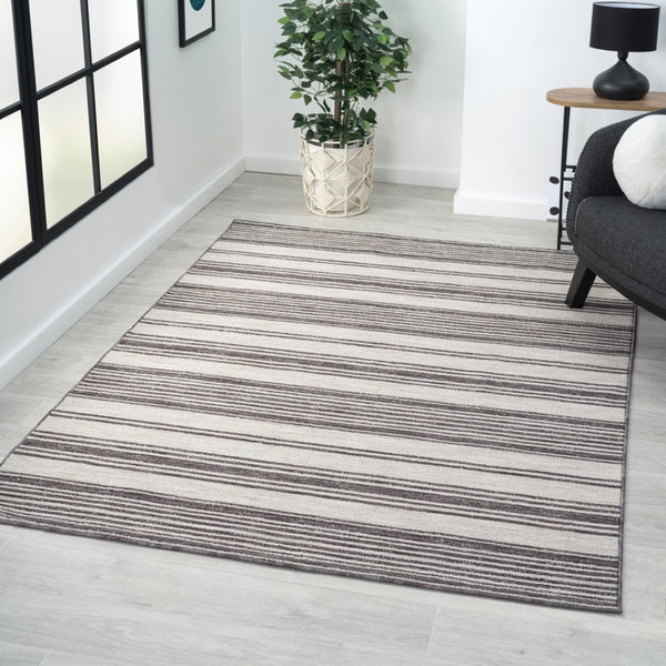 HomeRoots 5' Gray and Ivory Striped Area Rug - Durable, Stylish Design for Indoor and Outdoor Living Spaces 5' x 7' 517494
