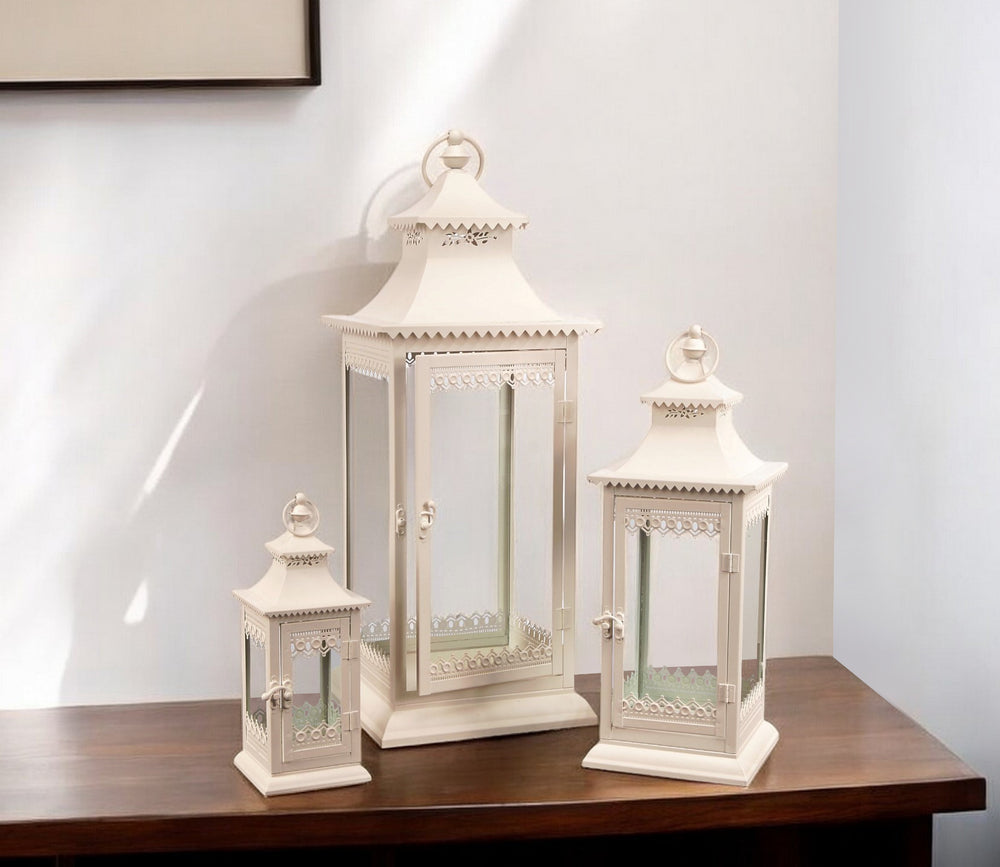 Homeroots Set Of Three Ivory Glass And Metal Ornate Floor Lantern Candle Holders   517552