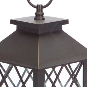 HomeRoots Set of Three Dark Brown Distressed Lantern Candle Holders with Ornate Design – Perfect for Any Space! 517555