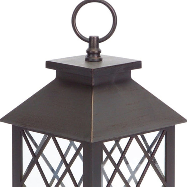HomeRoots Set of Three Dark Brown Distressed Lantern Candle Holders with Ornate Design – Perfect for Any Space! 517555