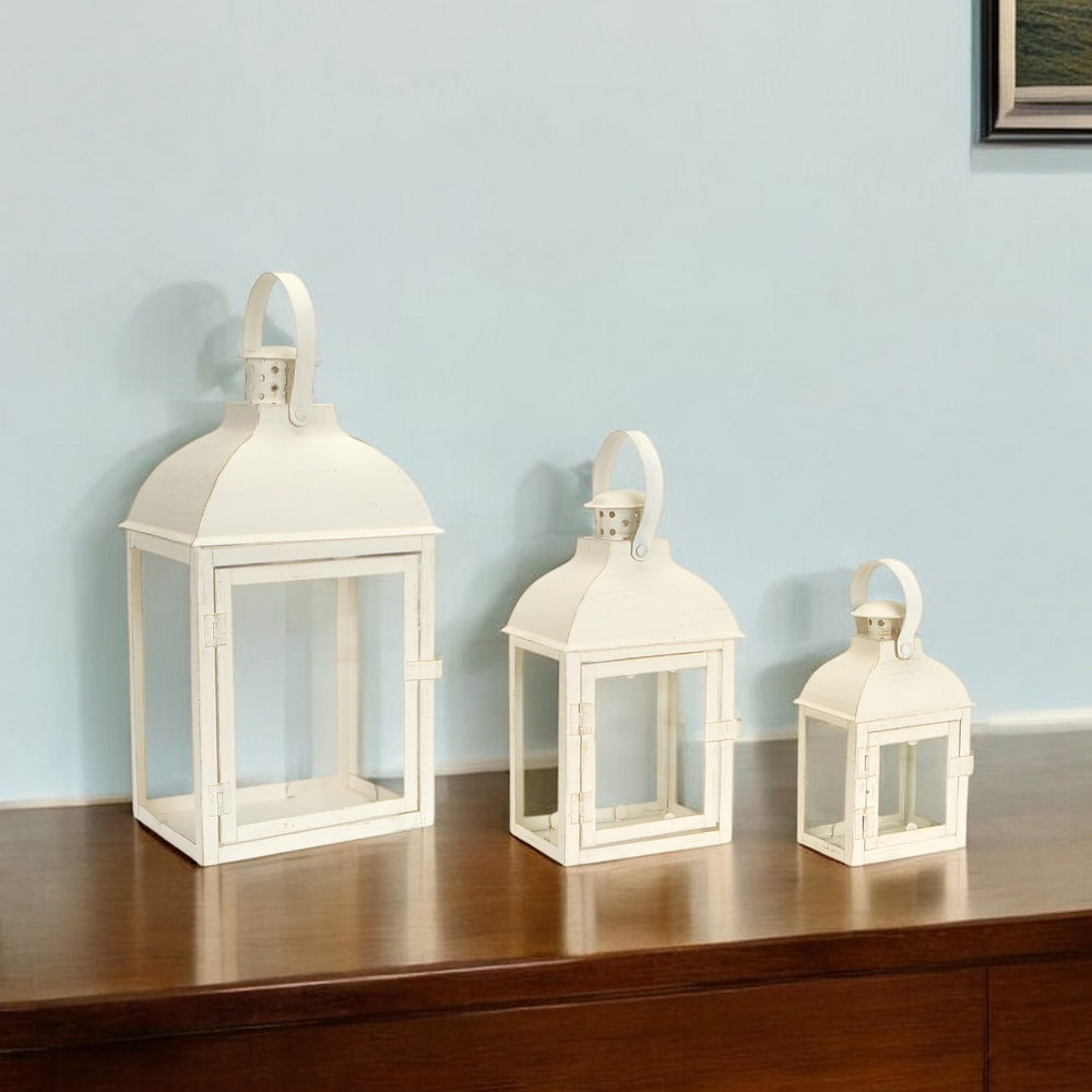 Homeroots Set Of Three Elegant Ivory Glass And Metal Floor Lantern Candle Holders For Any Occasion Decor   517561