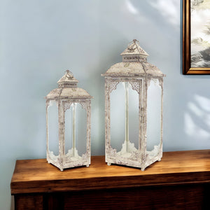 Homeroots Set Of Two Beige Glass And Metal Distressed Floor Lantern Candle Holders   517563