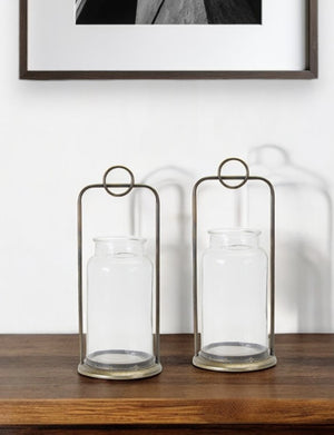 Homeroots Set Of Two Bronze Metal And Glass Tabletop Hurricane Candle Holders   517597