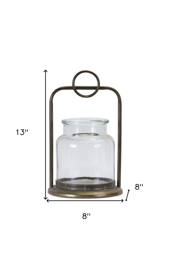 Homeroots Set Of Two Bronze Glass And Metal Tabletop Hurricane Candle Holders   517598