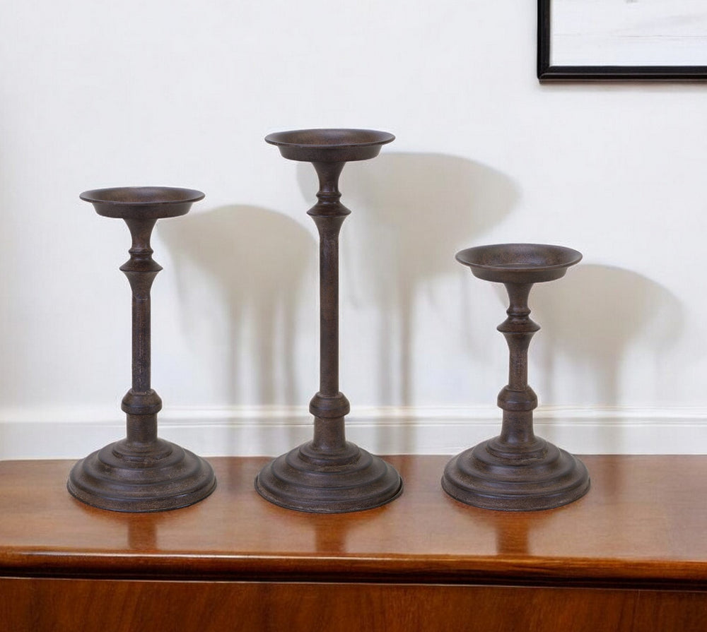 Homeroots Set Of Three Brown Rustic Resin Tabletop Pillar Candle Holders   517622