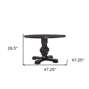 Homeroots 47" Black Rounded Solid Wood Pedestal Base Dining Table   517747