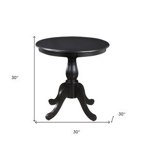 Homeroots 30" Black Rounded Solid Manufactured Wood And Solid Wood Pedestal Base Dining Table   517748