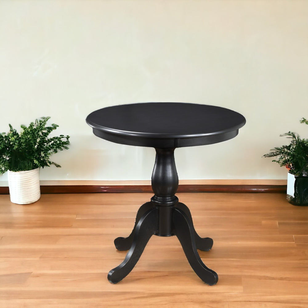 HomeRoots 30" Antique Black Round Pedestal Dining Table - Classic Solid Wood Design for Small Spaces & Nooks 517748