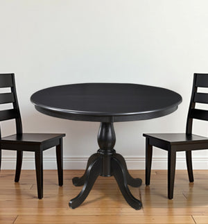 Homeroots 42" Black Rounded Solid Manufactured Wood And Solid Wood Pedestal Base Dining Table   517754
