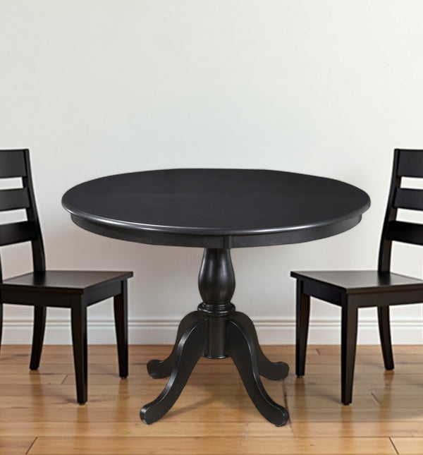 Homeroots 42" Black Rounded Solid Manufactured Wood And Solid Wood Pedestal Base Dining Table   517754