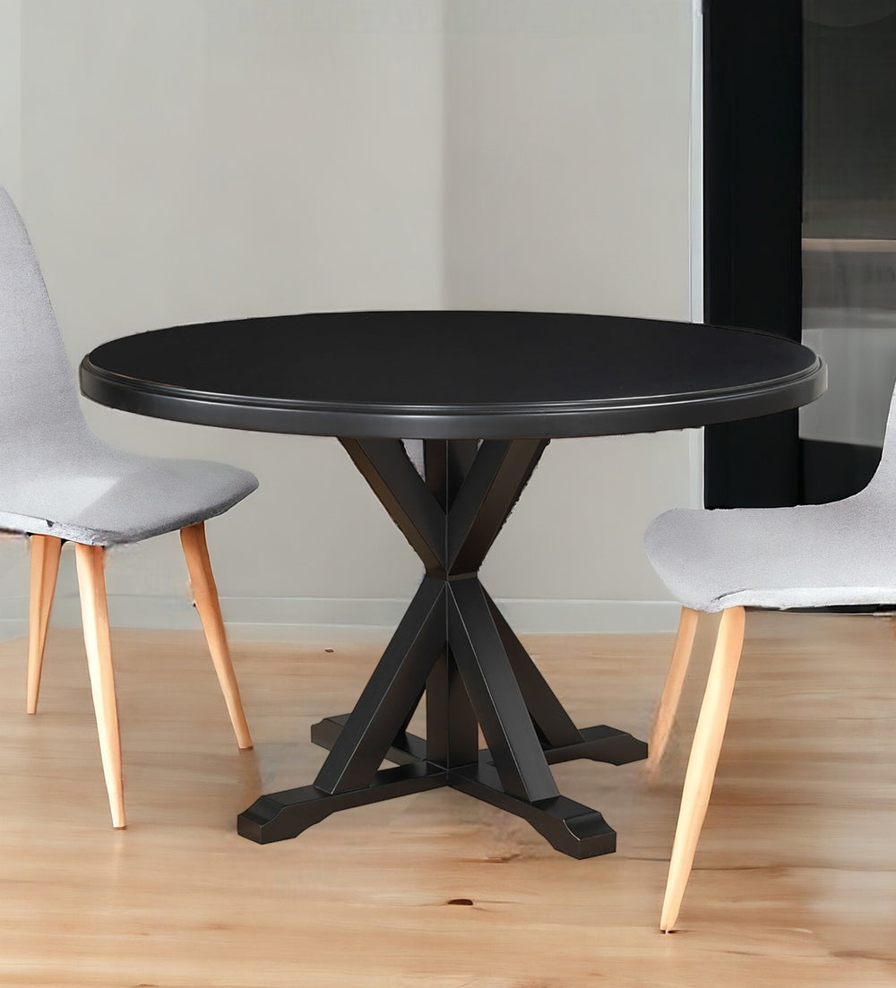 Homeroots 48" Black Rounded Solid Manufactured Wood And Solid Wood Pedestal Base Dining Table   517759
