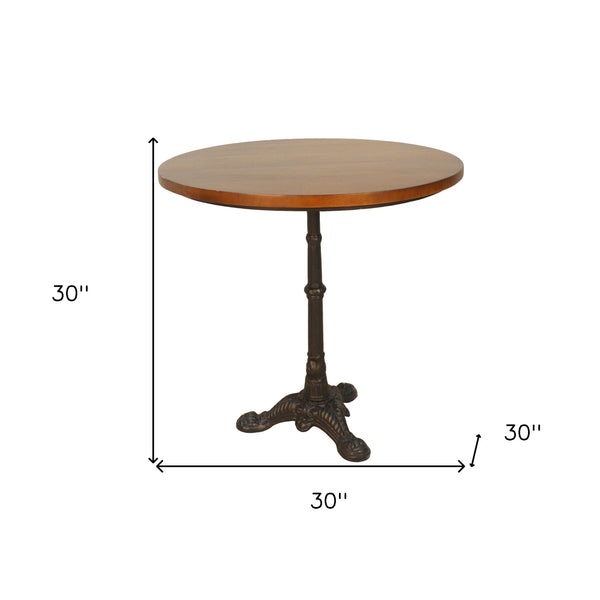Homeroots 30" Chestnut And Black Rounded Solid Wood And Iron Pedestal Base Dining Table   517761