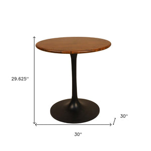HomeRoots 30" Brown and Black Round Solid Wood Pedestal Dining Table – Stylish, Compact, Perfect for Two! 517766