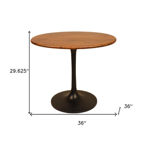 Homeroots 36" Brown And Black Rounded Solid Wood And Iron Pedestal Base Dining Table   517768
