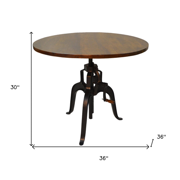 Homeroots Adjustable Height Brown And Black Solid Wood And Iron Pedestal Base Round Top Dining Table   517843