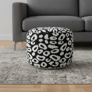 HomeRoots 18" Black Cylinder Pouf Ottoman - Versatile Abstract Accent for Modern Living Rooms & Bedrooms 517933