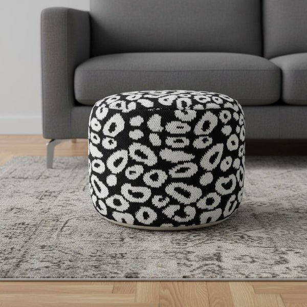 HomeRoots 18" Black Cylinder Pouf Ottoman - Versatile Abstract Accent for Modern Living Rooms & Bedrooms 517933