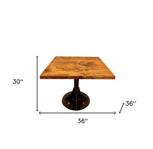 Homeroots 36" Brown And Black Square Solid Wood And Steel Pedestal Base Dining Table   518601