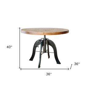 Homeroots 36" Brown And Black Rounded Solid Wood And Steel Pedestal Base Dining Table   518610