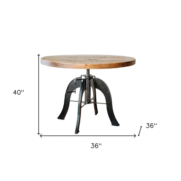 Homeroots 36" Brown And Black Rounded Solid Wood And Steel Pedestal Base Dining Table   518610