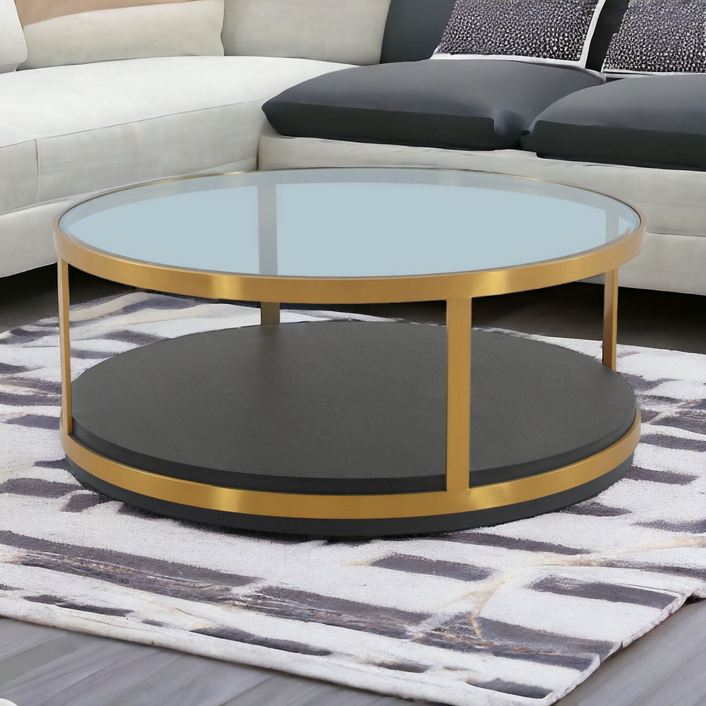 Homeroots 43" Clear And Black Gold Glass And Solid Wood And Metal Round Coffee Table With Shelf   520591