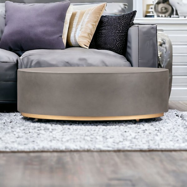 Homeroots 28" Gray And Brass Concrete And Brass Oval Coffee Table   520637