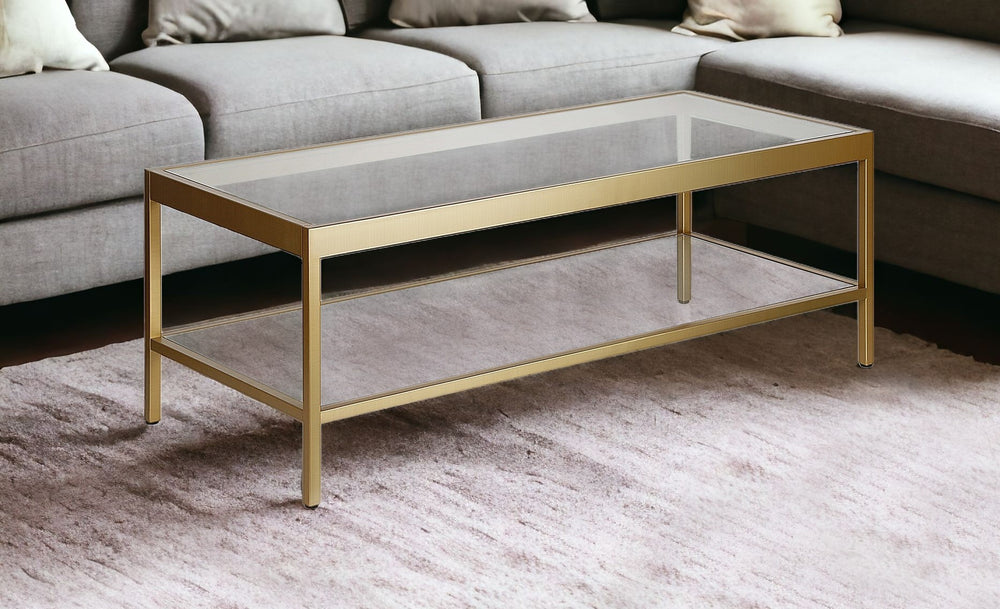 Homeroots 45" Clear Glass And Gold Steel Coffee Table With Shelf   520941