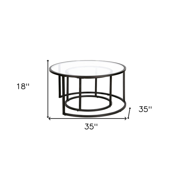 Homeroots Set Of Two 35" Black Glass And Steel Round Nested Coffee Tables   520943