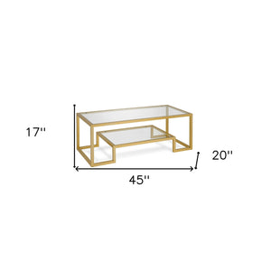 Homeroots 45" Clear And Gold Glass And Steel Coffee Table With Shelf   520965