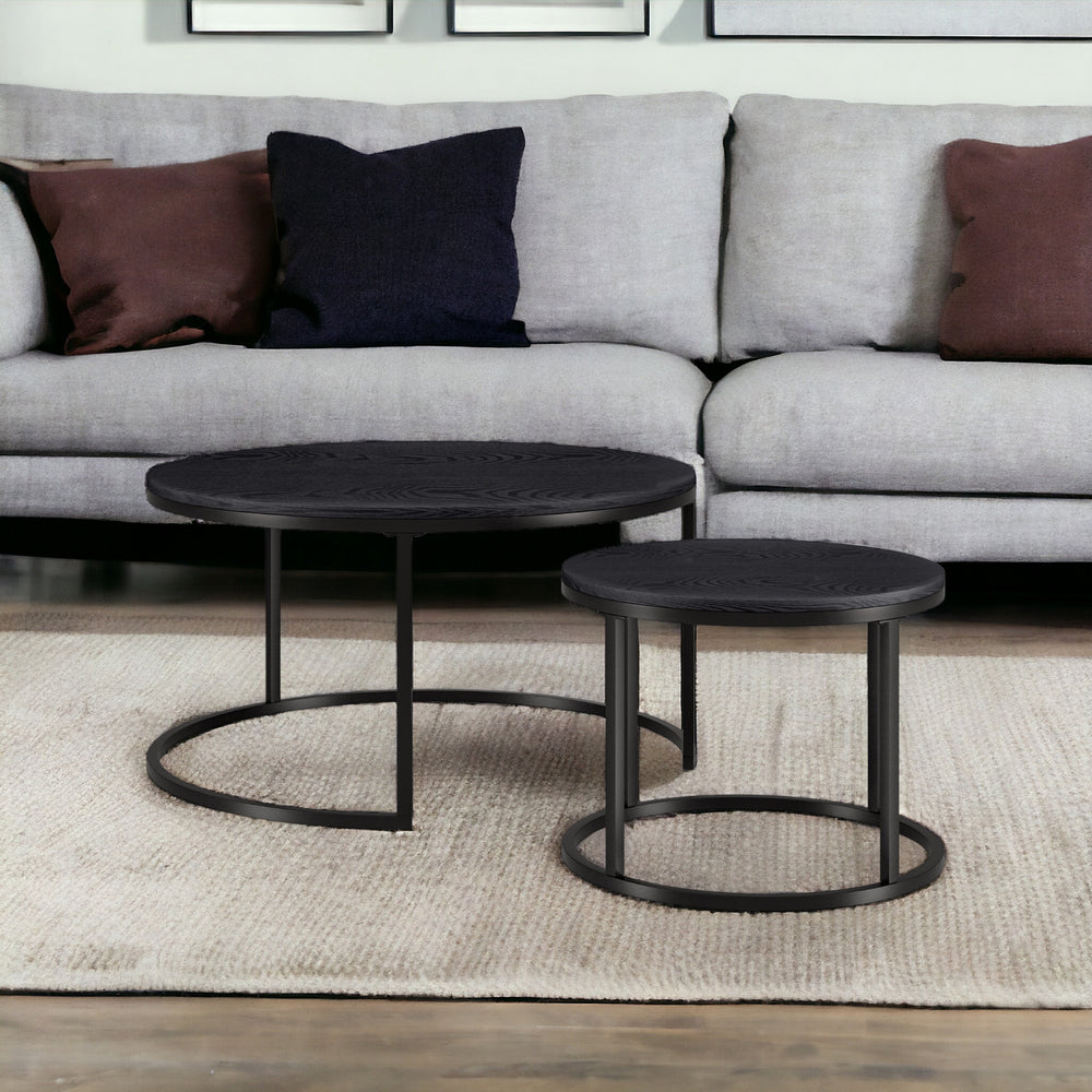 Homeroots Set Of Two 35" Black Steel Round Nested Coffee Tables   521016